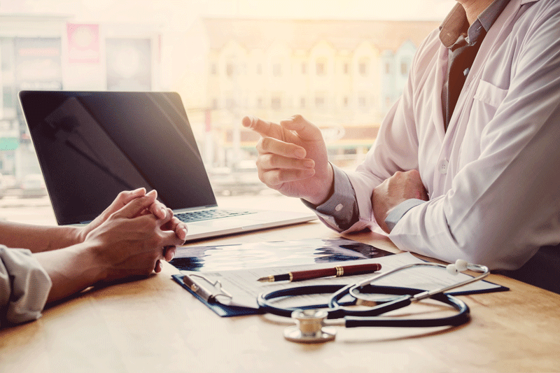 Picture of patient and doctor having an appointment.